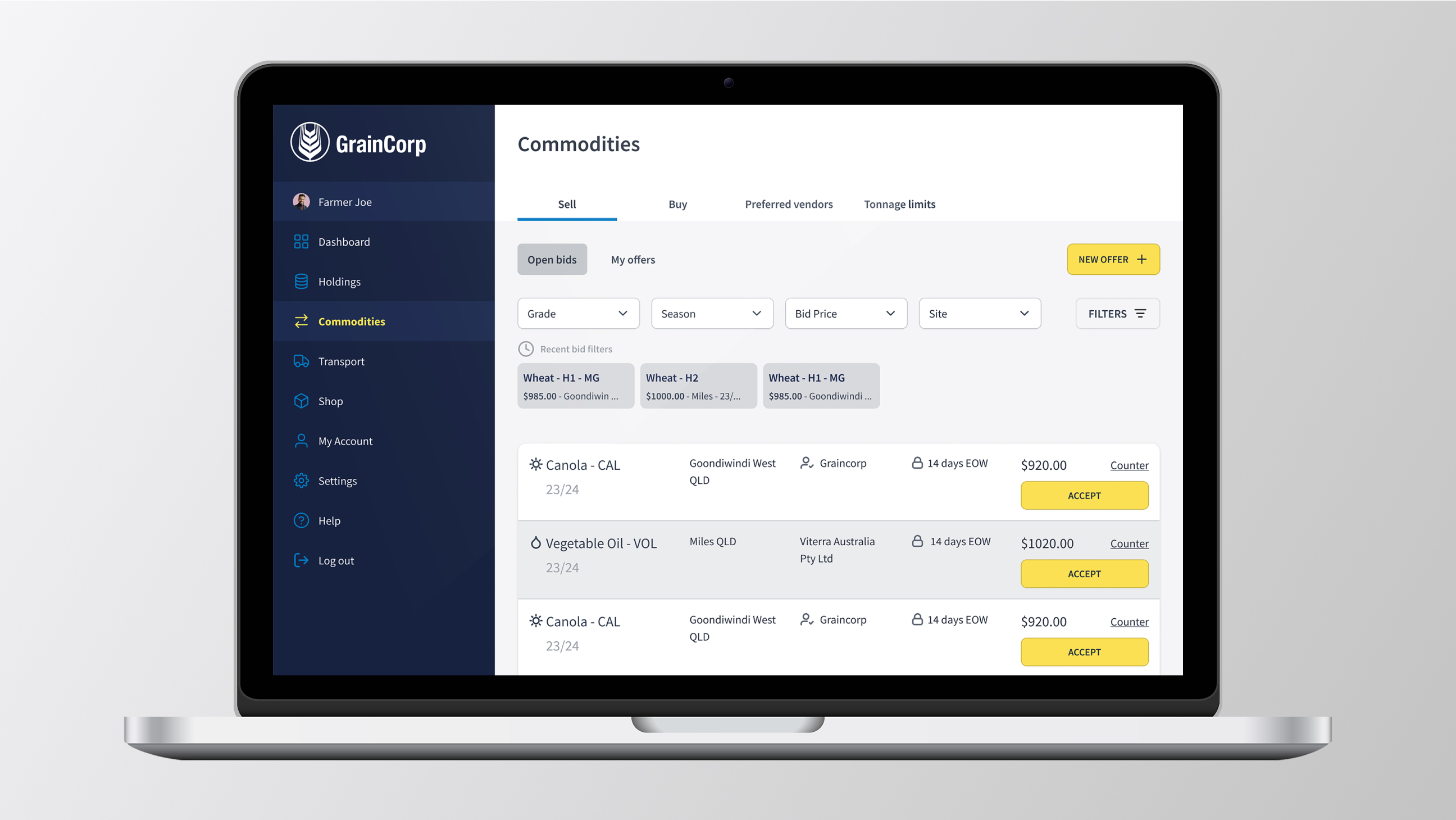 Laptop screen showing GrainCorp commodities trading dashboard with sell offers for canola and vegetable oil including prices, locations, and accept buttons.